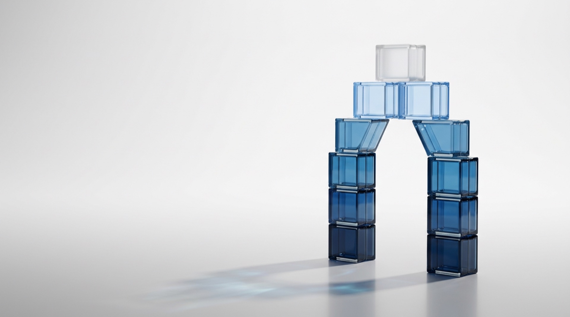 Arch of blue glass blocks representing a team building on each other's strengths at Data Understood