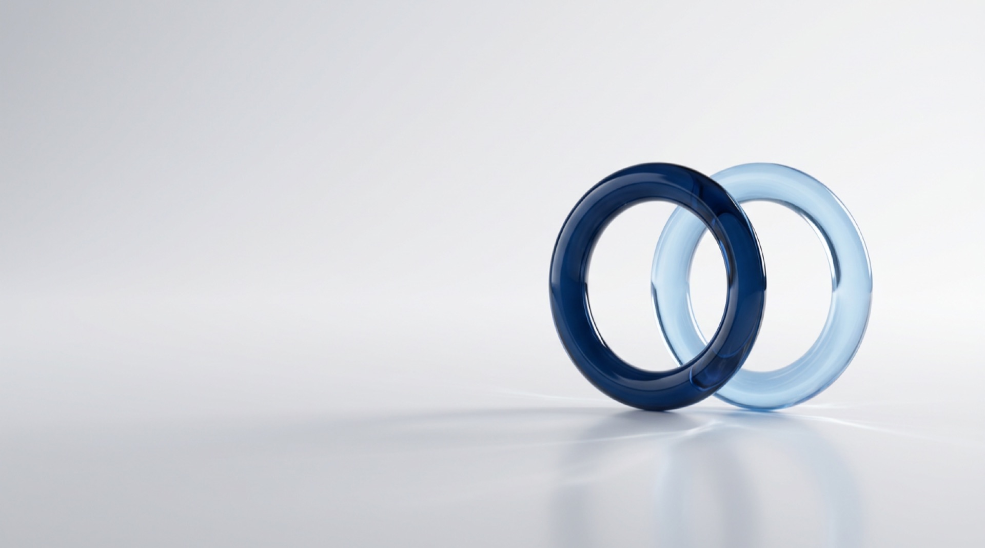 Two interlocking glass rings representing data that supports both care and compliance in health