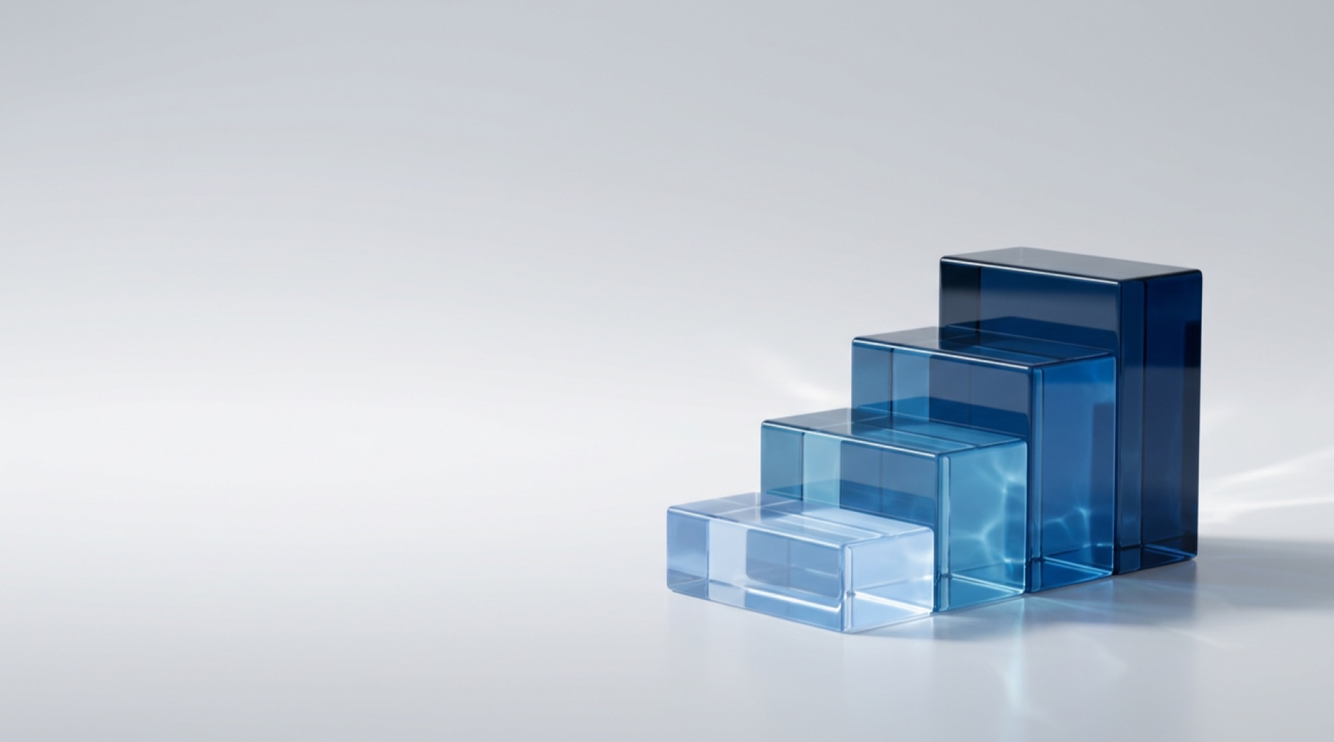 Four rising glass steps representing the Unearth, Reveal, Build, Achieve data strategy approach